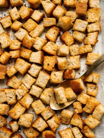 Looking for a simple and delicious way to use up leftover bread? Try this easy homemade croutons recipe that will elevate any salad or soup. | aheadofthyme.com