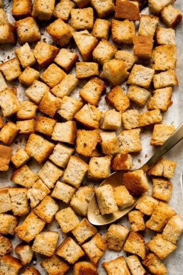 Looking for a simple and delicious way to use up leftover bread? Try this easy homemade croutons recipe that will elevate any salad or soup. | aheadofthyme.com
