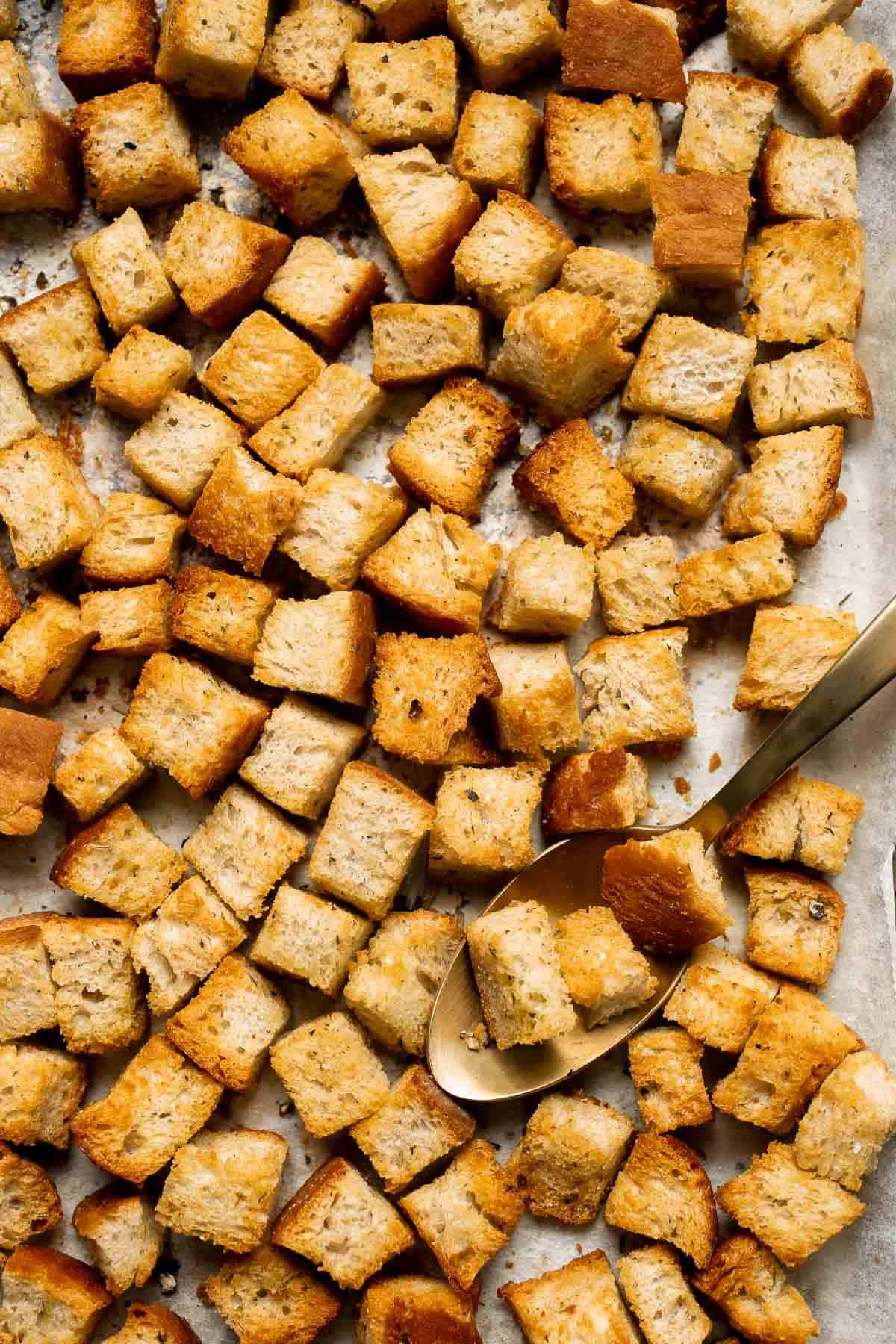 Looking for a simple and delicious way to use up leftover bread? Try this easy homemade croutons recipe that will elevate any salad or soup. | aheadofthyme.com