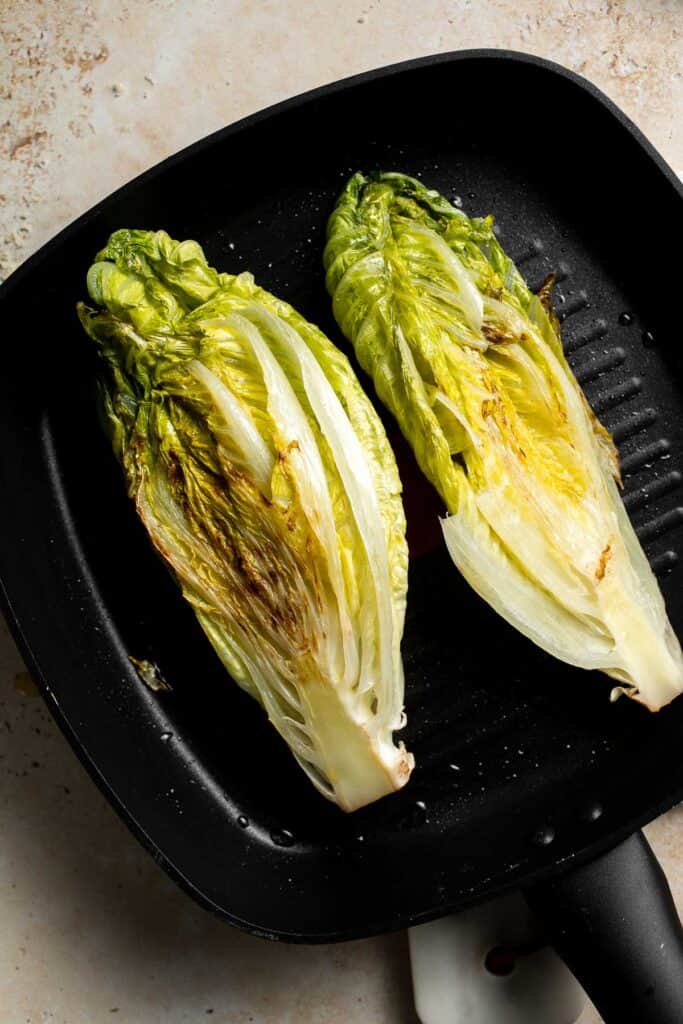 Elevate your salad game with this grilled romaine Caesar salad and homemade dressing. The smoky flavor from grilling the lettuce adds a unique twist. | aheadofthyme.com