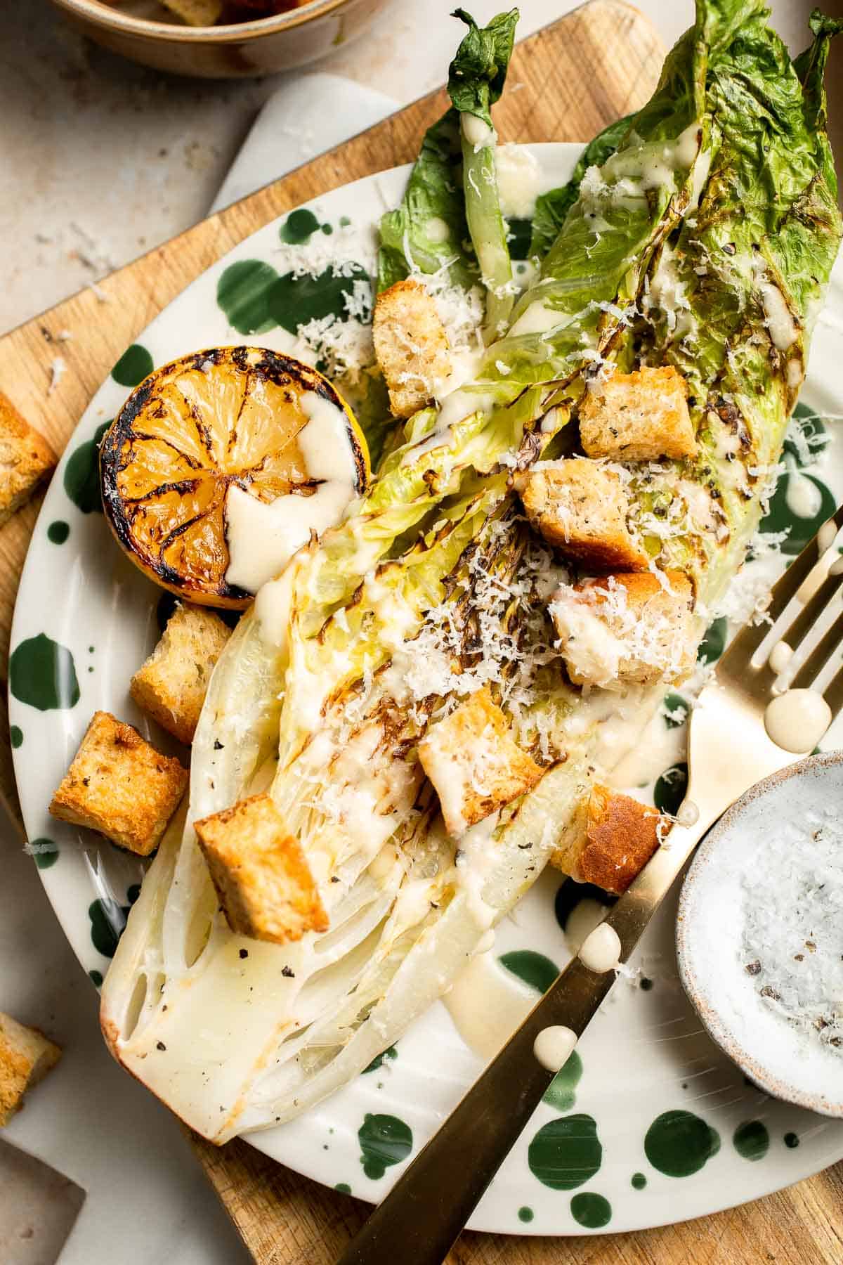 Elevate your salad game with this grilled romaine Caesar salad and homemade dressing. The smoky flavor from grilling the lettuce adds a unique twist. | aheadofthyme.com