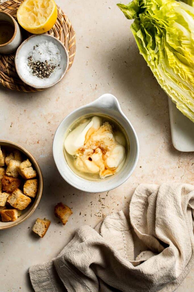 Elevate your salad game with this grilled romaine Caesar salad and homemade dressing. The smoky flavor from grilling the lettuce adds a unique twist. | aheadofthyme.com