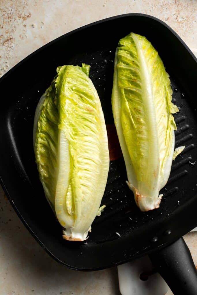 Elevate your salad game with this grilled romaine Caesar salad and homemade dressing. The smoky flavor from grilling the lettuce adds a unique twist. | aheadofthyme.com