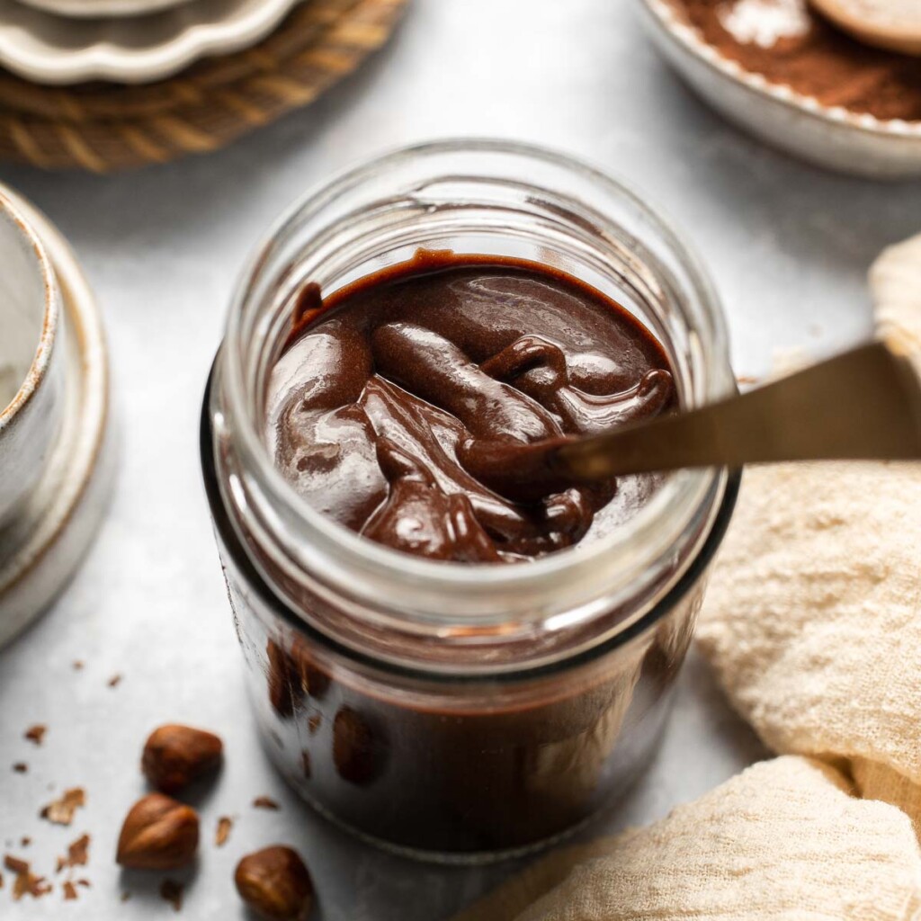 Skip the store-bought version and make your own homemade Nutella with this easy recipe. A chocolate hazelnut spread that is creamy, quick, and ready in 20! | aheadofthyme.com