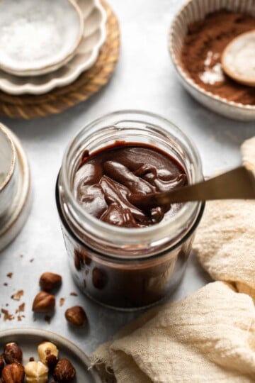 Skip the store-bought version and make your own homemade Nutella with this easy recipe. A chocolate hazelnut spread that is creamy, quick, and ready in 20! | aheadofthyme.com