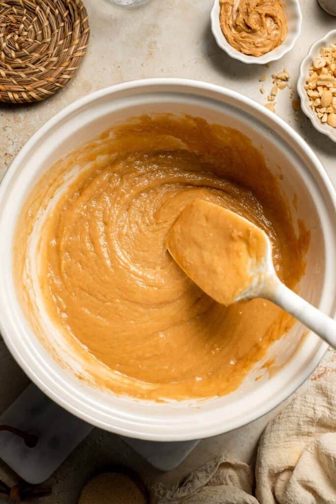 Delicious, protein-packed peanut butter muffins with a crunchy streusel topping are perfect for breakfast or as a midday snack. Soft, fluffy, and tasty! | aheadofthyme.com