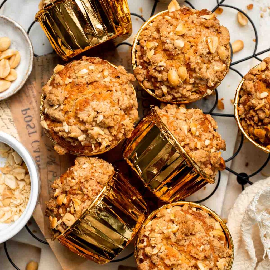 Delicious, protein-packed peanut butter muffins with a crunchy streusel topping are perfect for breakfast or as a midday snack. Soft, fluffy, and tasty! | aheadofthyme.com