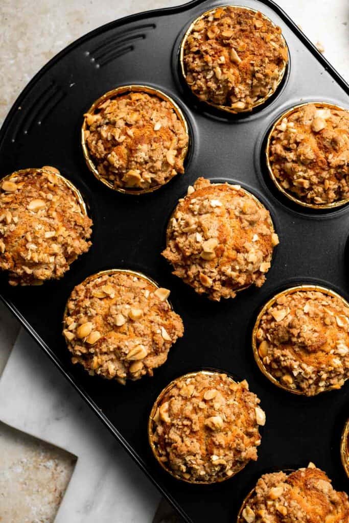 Delicious, protein-packed peanut butter muffins with a crunchy streusel topping are perfect for breakfast or as a midday snack. Soft, fluffy, and tasty! | aheadofthyme.com