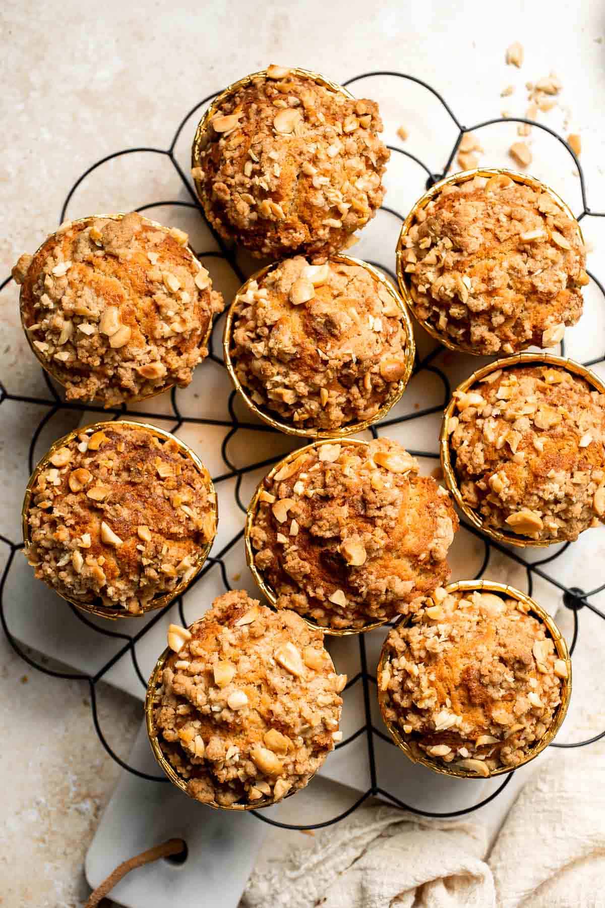 Delicious, protein-packed peanut butter muffins with a crunchy streusel topping are perfect for breakfast or as a midday snack. Soft, fluffy, and tasty! | aheadofthyme.com