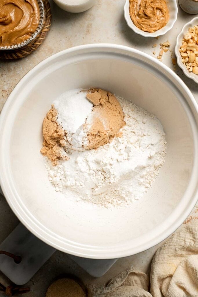 Delicious, protein-packed peanut butter muffins with a crunchy streusel topping are perfect for breakfast or as a midday snack. Soft, fluffy, and tasty! | aheadofthyme.com
