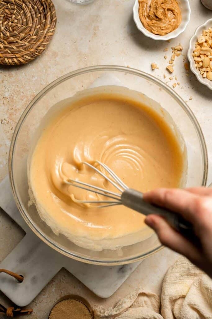 Delicious, protein-packed peanut butter muffins with a crunchy streusel topping are perfect for breakfast or as a midday snack. Soft, fluffy, and tasty! | aheadofthyme.com