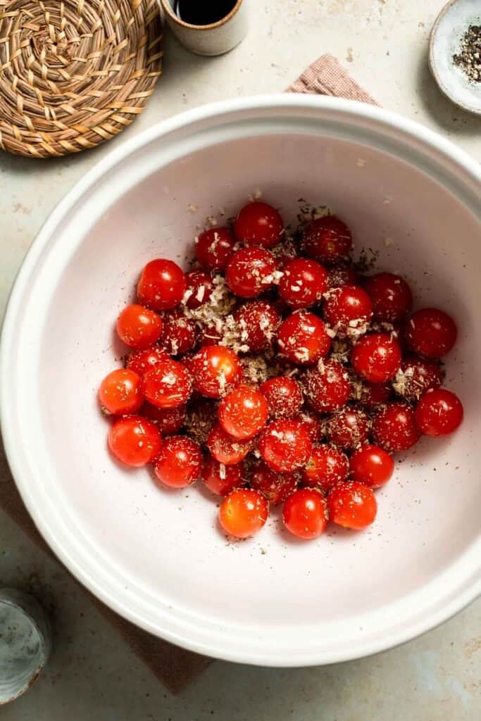 Easy to make and bursting with flavor, these juicy Roasted Cherry Tomatoes with garlic, herbs, and balsamic are the perfect addition to any meal. | aheadofthyme.com