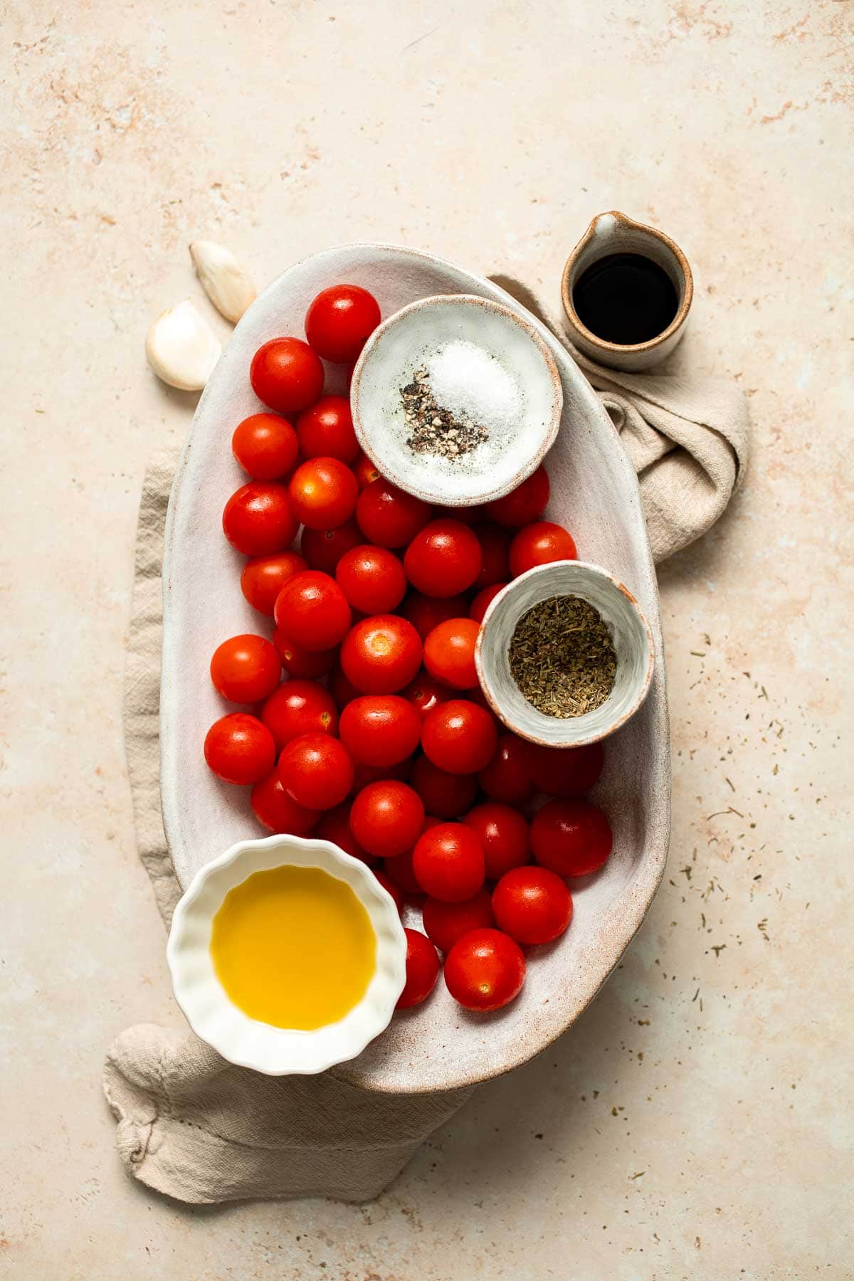 Easy to make and bursting with flavor, these juicy Roasted Cherry Tomatoes with garlic, herbs, and balsamic are the perfect addition to any meal. | aheadofthyme.com