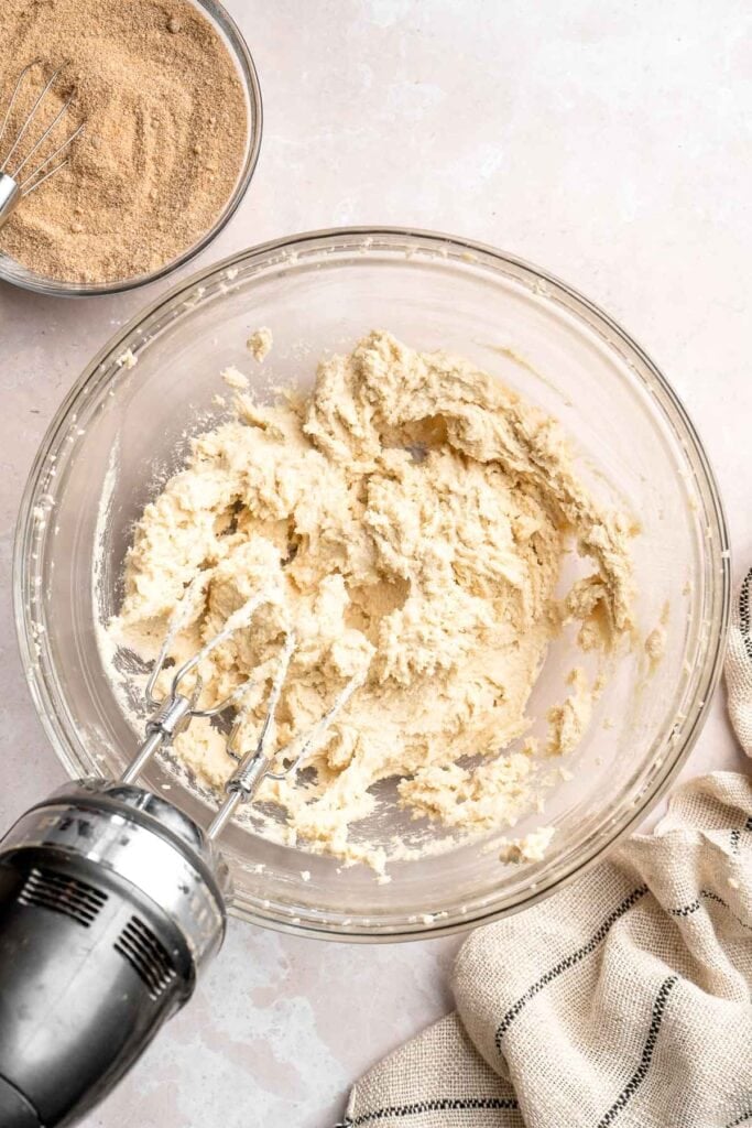 This sour cream coffee cake with cinnamon swirl is soft, buttery, and topped with crunchy streusel and vanilla glaze. Perfect for brunch or dessert. | aheadofthyme.com