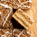 This sour cream coffee cake with cinnamon swirl is soft, buttery, and topped with crunchy streusel and vanilla glaze. Perfect for brunch or dessert. | aheadofthyme.com