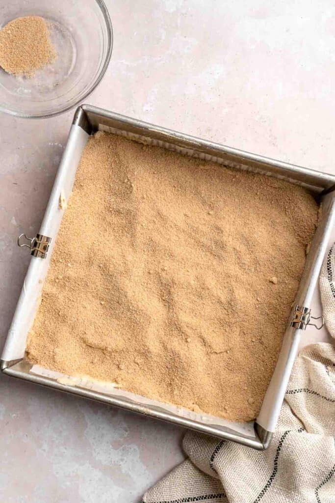 This sour cream coffee cake with cinnamon swirl is soft, buttery, and topped with crunchy streusel and vanilla glaze. Perfect for brunch or dessert. | aheadofthyme.com