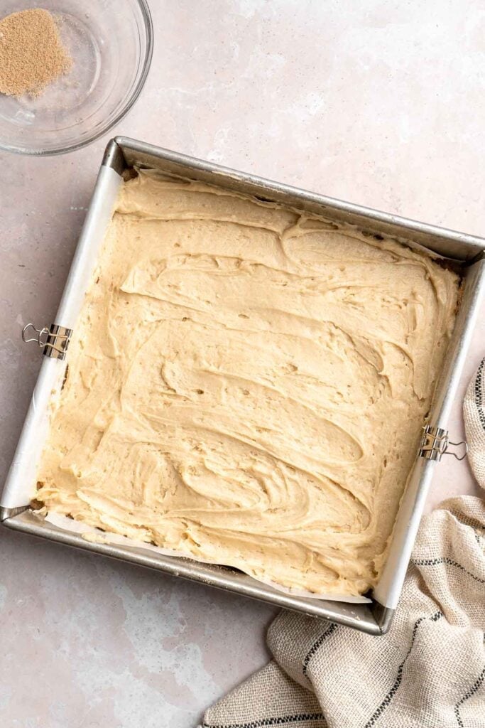 This sour cream coffee cake with cinnamon swirl is soft, buttery, and topped with crunchy streusel and vanilla glaze. Perfect for brunch or dessert. | aheadofthyme.com