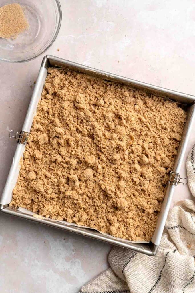 This sour cream coffee cake with cinnamon swirl is soft, buttery, and topped with crunchy streusel and vanilla glaze. Perfect for brunch or dessert. | aheadofthyme.com
