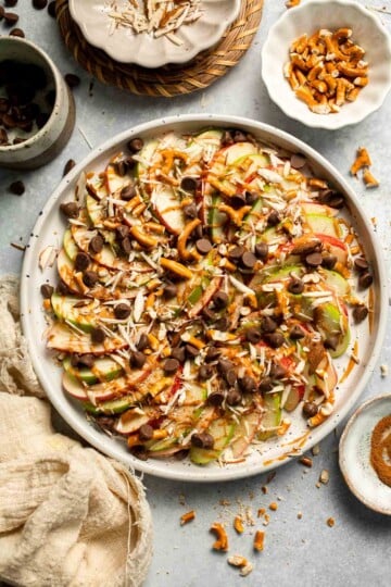 Apple Nachos are a quick, healthy snack made with crisp apples, nut butter, and toppings. Fun, customizable, and ready in minutes! | aheadofthyme.com