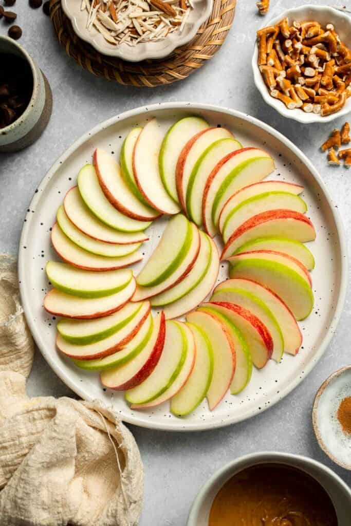 Apple Nachos are a quick, healthy snack made with crisp apples, nut butter, and toppings. Fun, customizable, and ready in minutes! | aheadofthyme.com