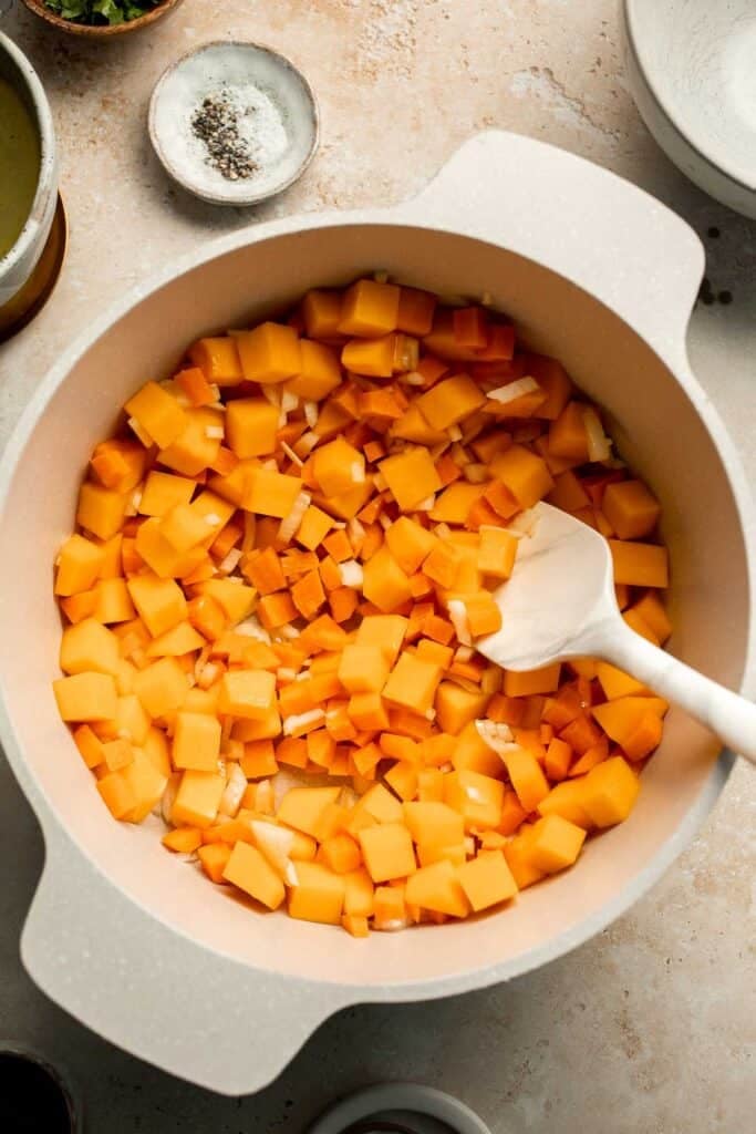Enjoy a cozy bowl of butternut squash lentil soup, packed with protein, fiber, and nutrients. This hearty recipe makes the ultimate plant-based meal. | aheadofthyme.com