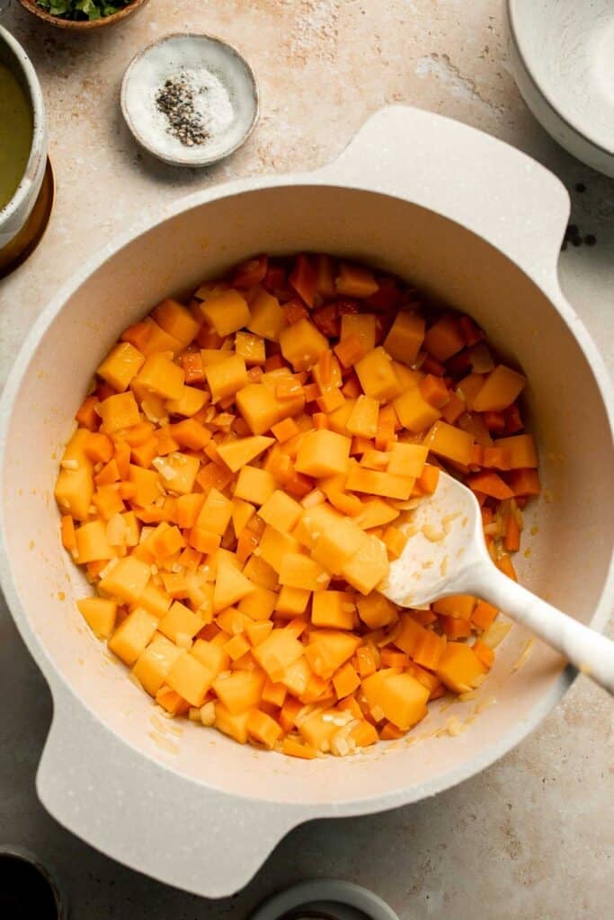 Enjoy a cozy bowl of butternut squash lentil soup, packed with protein, fiber, and nutrients. This hearty recipe makes the ultimate plant-based meal. | aheadofthyme.com