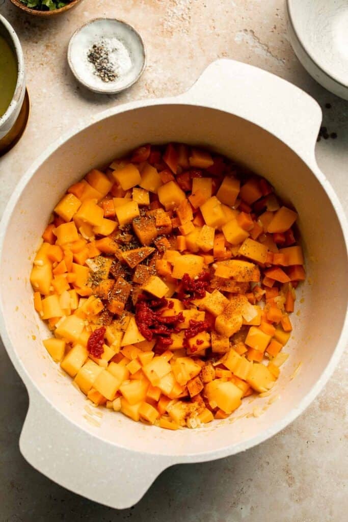 Enjoy a cozy bowl of butternut squash lentil soup, packed with protein, fiber, and nutrients. This hearty recipe makes the ultimate plant-based meal. | aheadofthyme.com