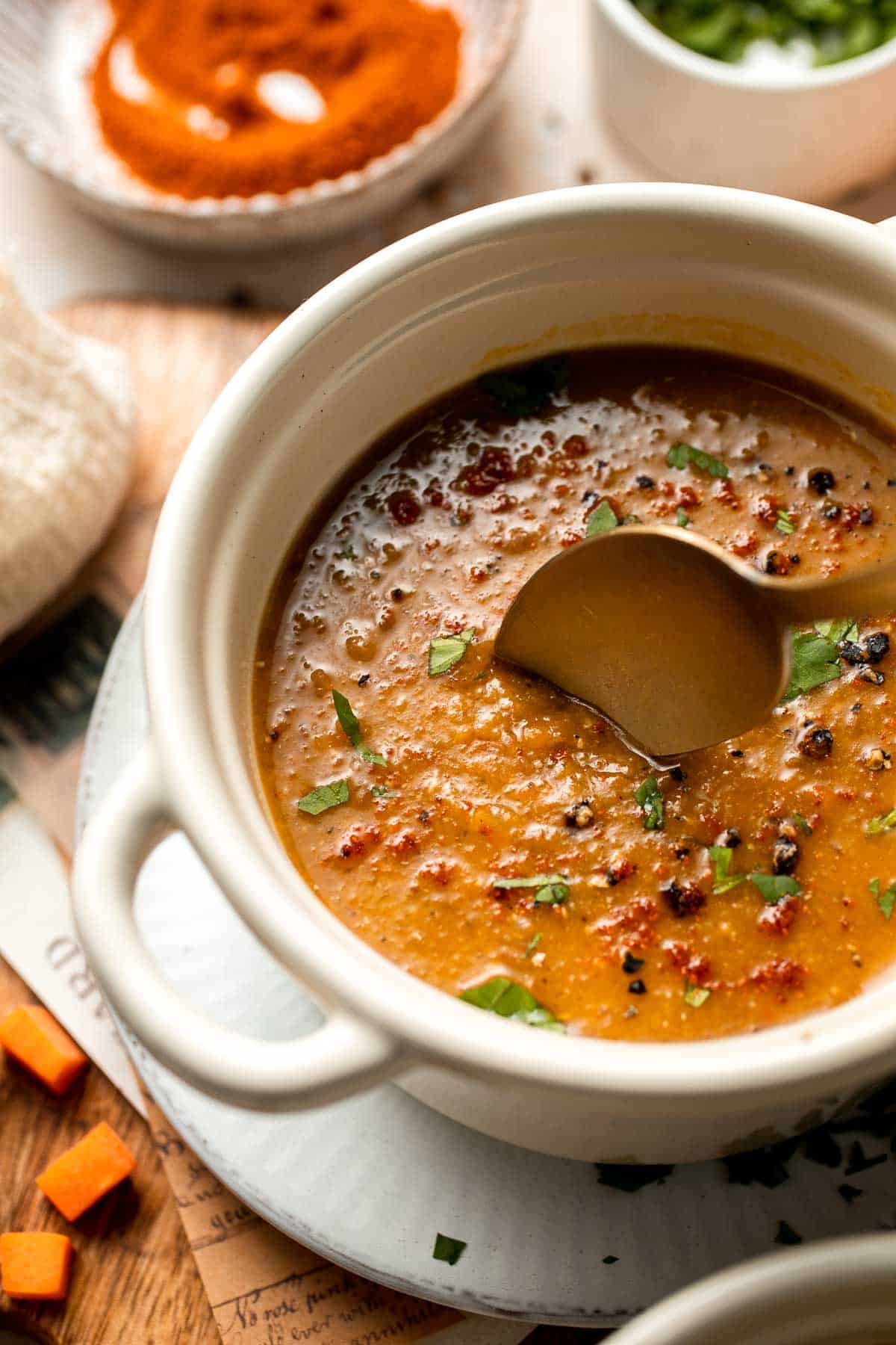 Enjoy a cozy bowl of butternut squash lentil soup, packed with protein, fiber, and nutrients. This hearty recipe makes the ultimate plant-based meal. | aheadofthyme.com