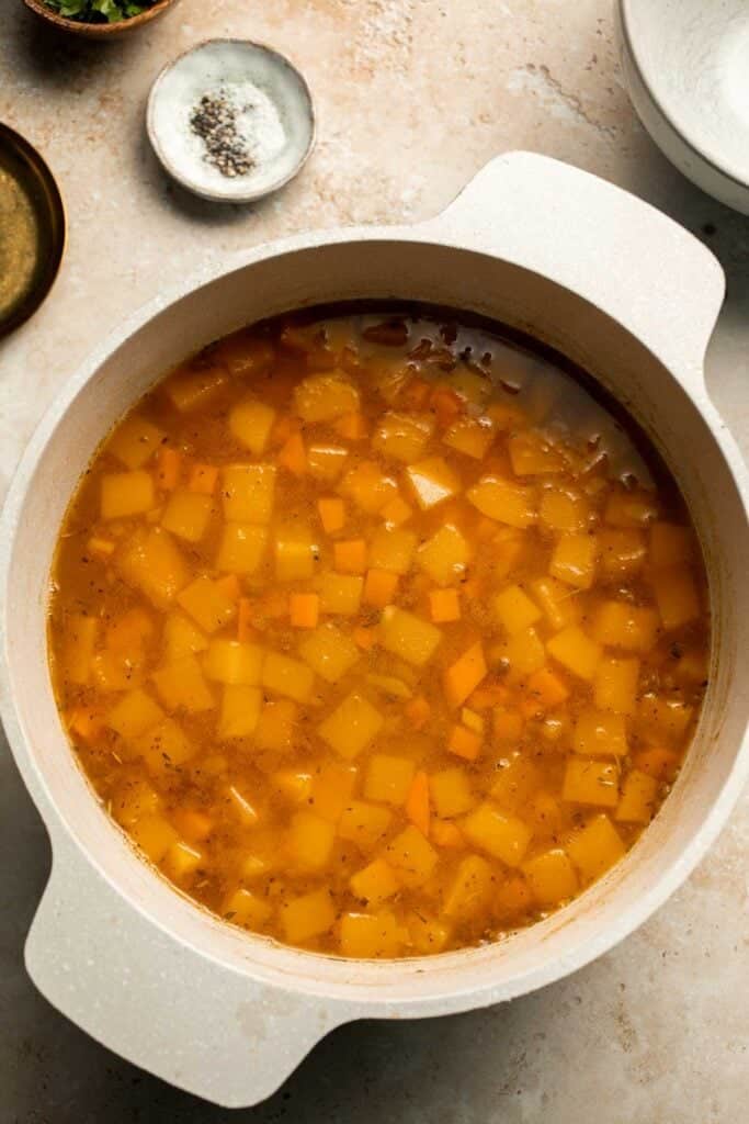 Enjoy a cozy bowl of butternut squash lentil soup, packed with protein, fiber, and nutrients. This hearty recipe makes the ultimate plant-based meal. | aheadofthyme.com