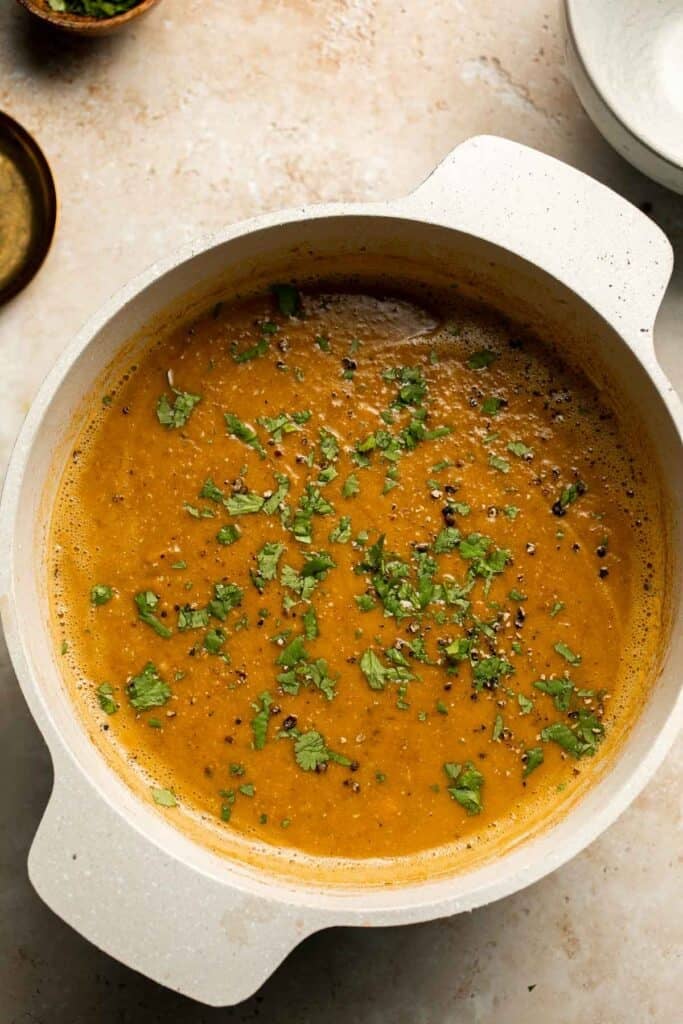 Enjoy a cozy bowl of butternut squash lentil soup, packed with protein, fiber, and nutrients. This hearty recipe makes the ultimate plant-based meal. | aheadofthyme.com