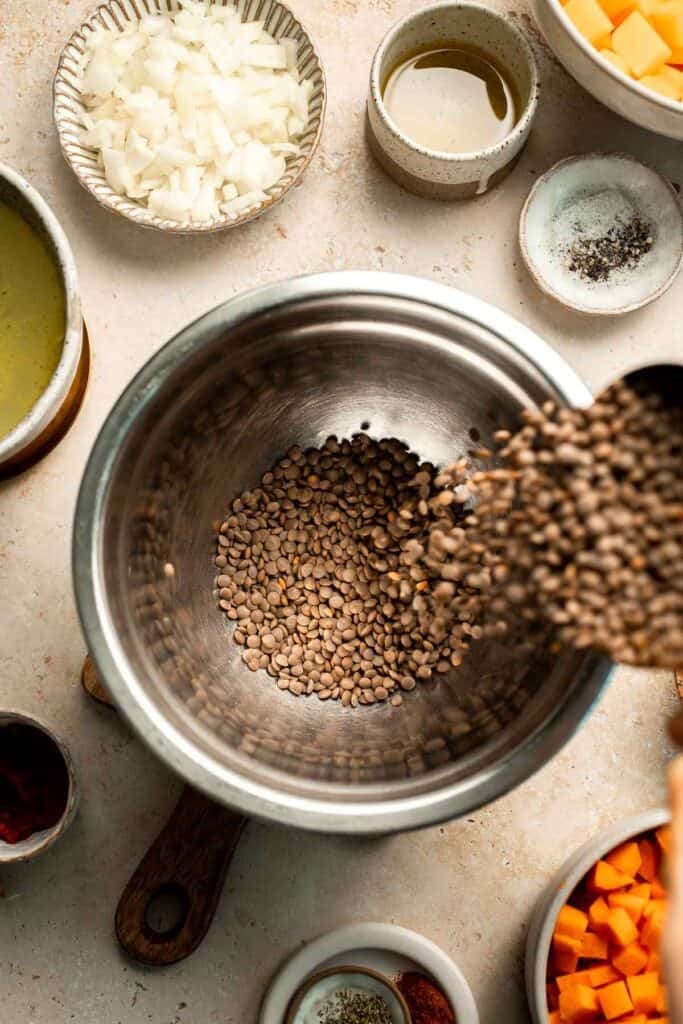 Enjoy a cozy bowl of butternut squash lentil soup, packed with protein, fiber, and nutrients. This hearty recipe makes the ultimate plant-based meal. | aheadofthyme.com