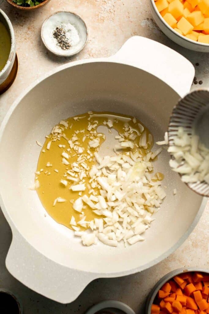 Enjoy a cozy bowl of butternut squash lentil soup, packed with protein, fiber, and nutrients. This hearty recipe makes the ultimate plant-based meal. | aheadofthyme.com