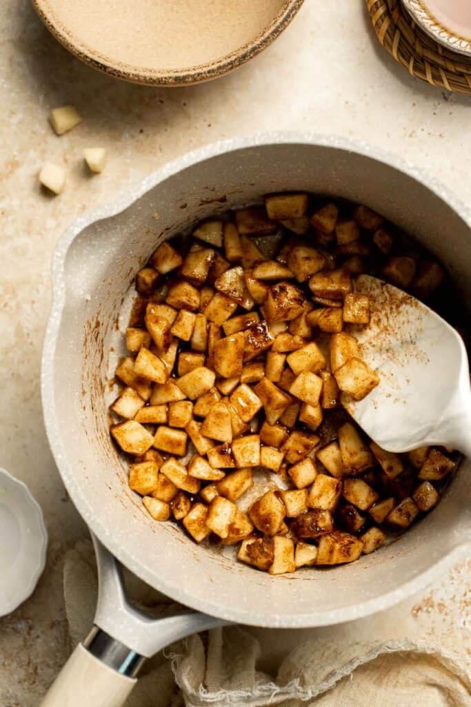 Add a touch of sweetness to your breakfast or dessert with this easy caramelized apple topping recipe. Perfect for pancakes, waffles, ice cream, and more! | aheadofthyme.com