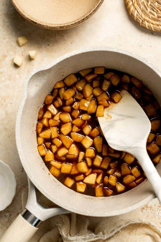 Add a touch of sweetness to your breakfast or dessert with this easy caramelized apple topping recipe. Perfect for pancakes, waffles, ice cream, and more! | aheadofthyme.com
