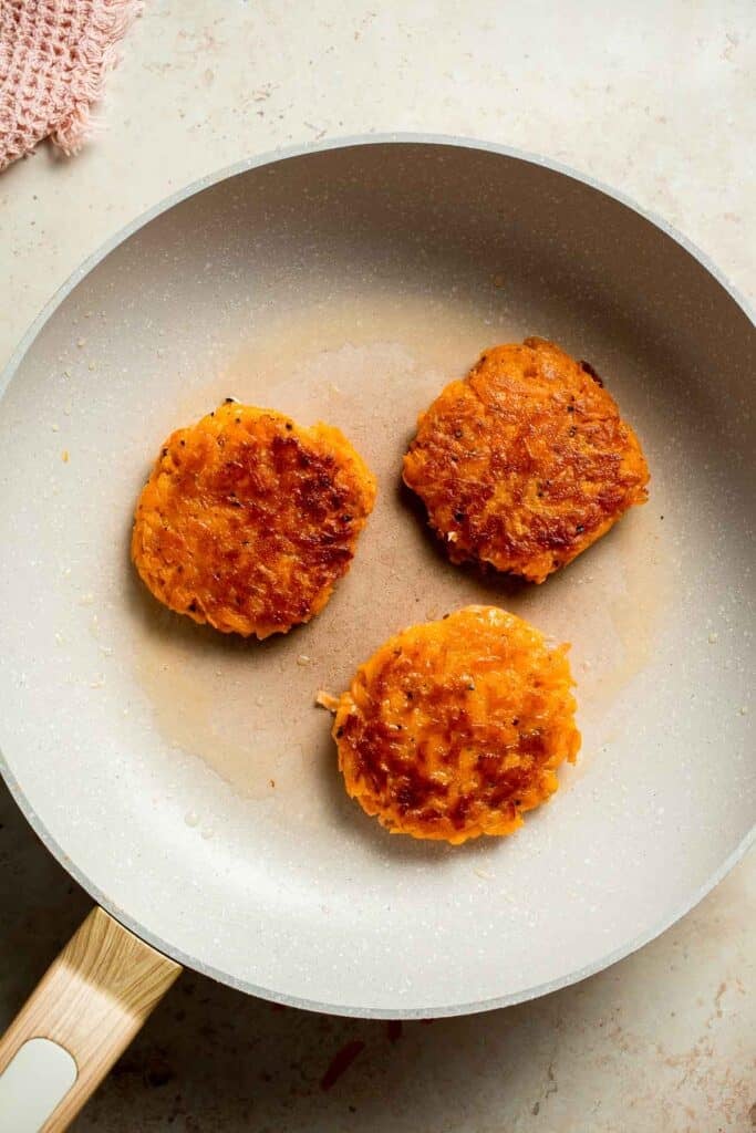 Crispy Sweet Potato Hash Browns are a quick, easy, and healthy breakfast side. Golden brown edges with tender, flavorful centers every time! | aheadofthyme.com