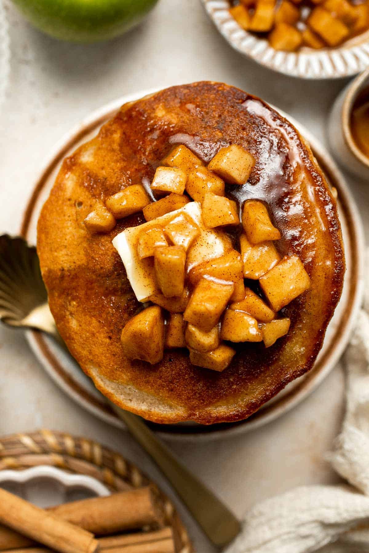 Start your morning with fluffy Apple Cinnamon Pancakes, made with fresh apples and warm spices for the perfect cozy fall breakfast. | aheadofthyme.com