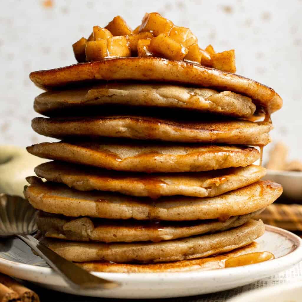 Start your morning with fluffy Apple Cinnamon Pancakes, made with fresh apples and warm spices for the perfect cozy fall breakfast. | aheadofthyme.com
