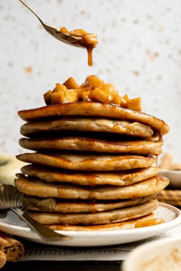 Start your morning with fluffy Apple Cinnamon Pancakes, made with fresh apples and warm spices for the perfect cozy fall breakfast. | aheadofthyme.com