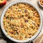 This easy apple slaw recipe is the perfect combination of crisp apples, crunchy cabbage, and a creamy dressing. A fresh side dish ready in 10 minutes! | aheadofthyme.com