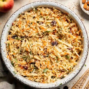 This easy apple slaw recipe is the perfect combination of crisp apples, crunchy cabbage, and a creamy dressing. A fresh side dish ready in 10 minutes! | aheadofthyme.com