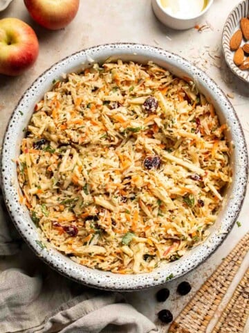 This easy apple slaw recipe is the perfect combination of crisp apples, crunchy cabbage, and a creamy dressing. A fresh side dish ready in 10 minutes! | aheadofthyme.com