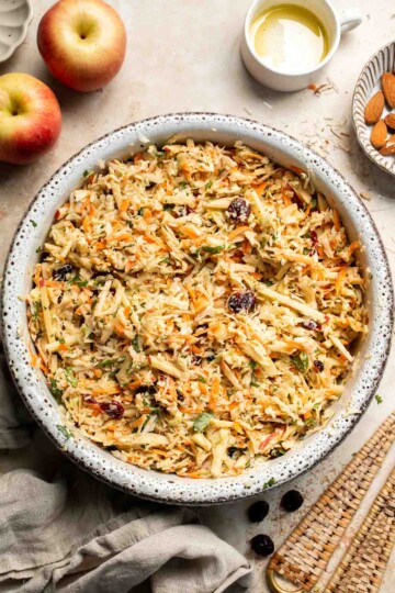 This easy apple slaw recipe is the perfect combination of crisp apples, crunchy cabbage, and a creamy dressing. A fresh side dish ready in 10 minutes! | aheadofthyme.com