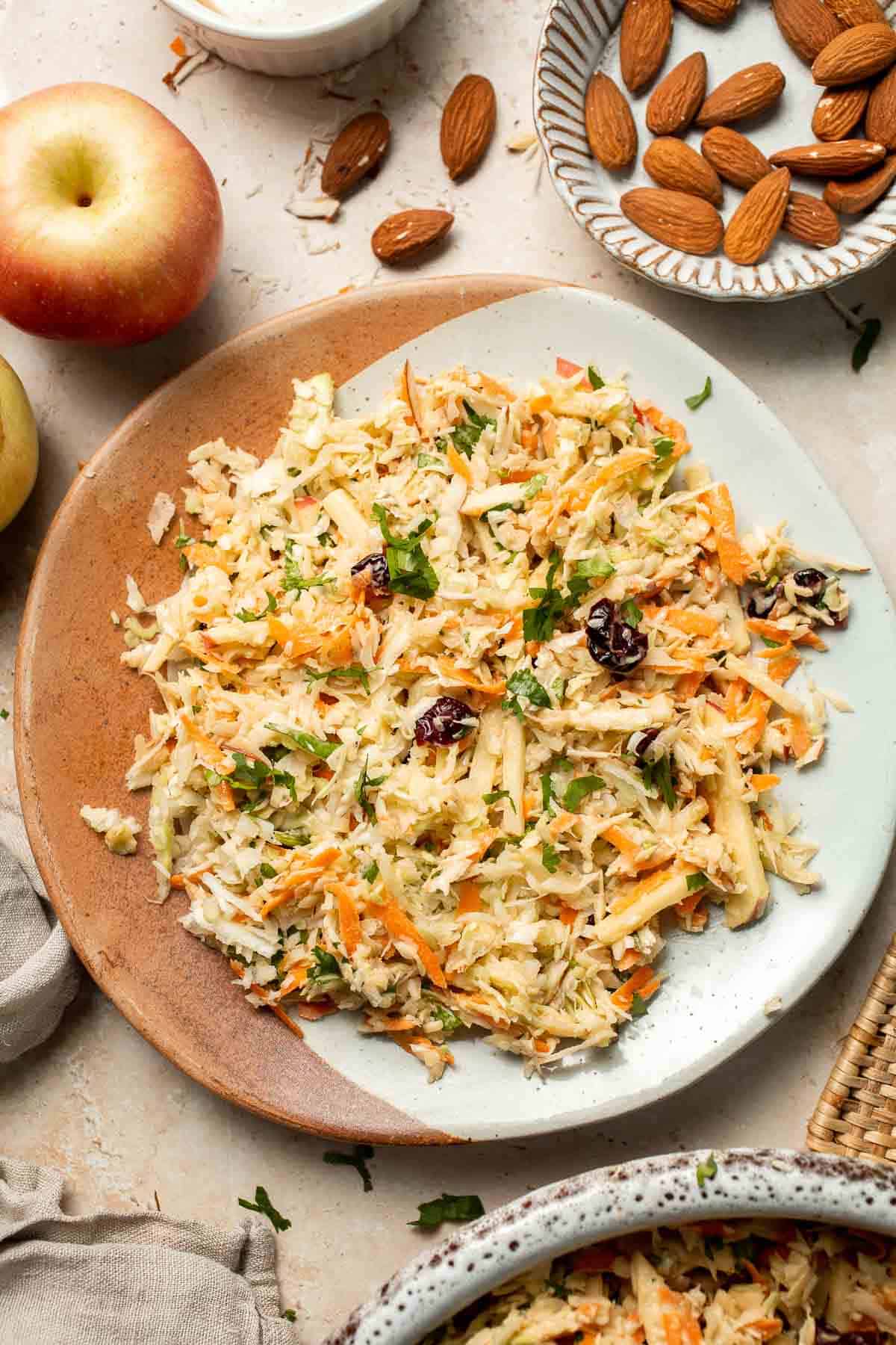 This easy apple slaw recipe is the perfect combination of crisp apples, crunchy cabbage, and a creamy dressing. A fresh side dish ready in 10 minutes! | aheadofthyme.com