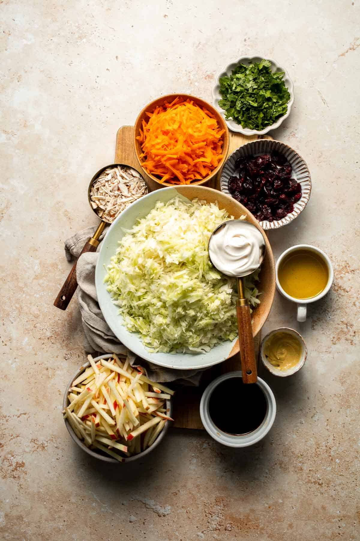 This easy apple slaw recipe is the perfect combination of crisp apples, crunchy cabbage, and a creamy dressing. A fresh side dish ready in 10 minutes! | aheadofthyme.com
