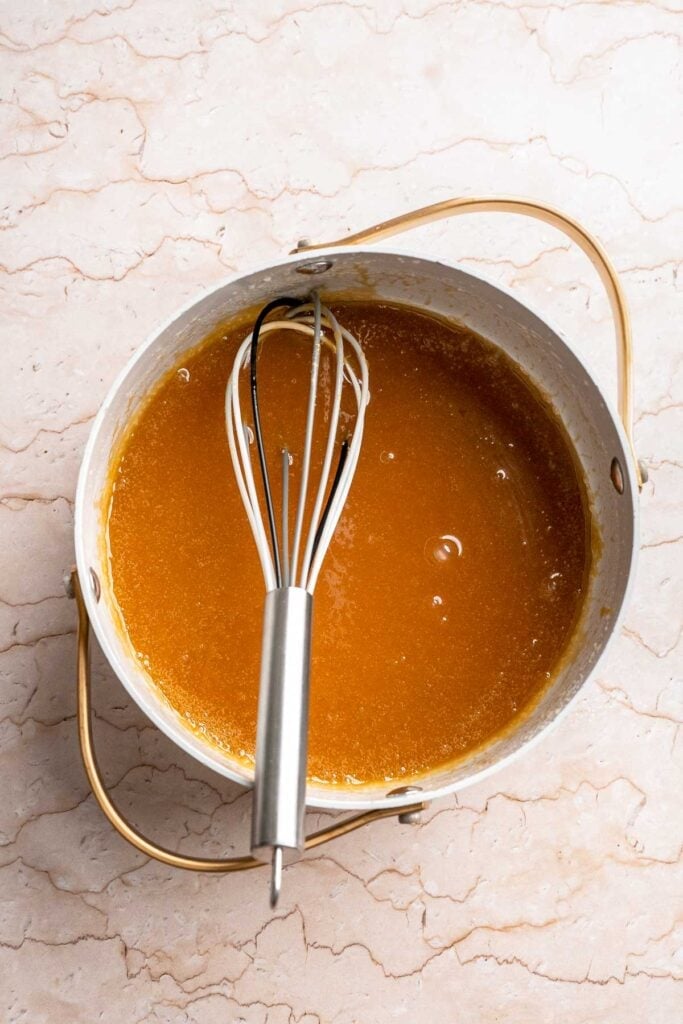 Homemade Caramel Apple Pie is warm, spiced, and gooey. A classic apple pie with caramel sauce baked inside for the ultimate fall dessert. | aheadofthyme.com