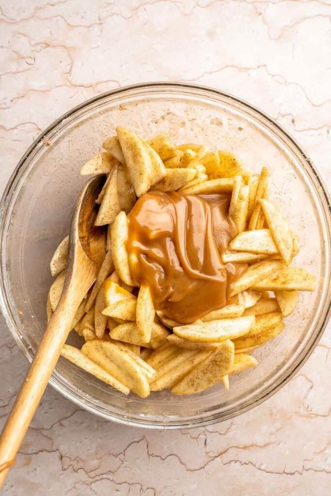Homemade Caramel Apple Pie is warm, spiced, and gooey. A classic apple pie with caramel sauce baked inside for the ultimate fall dessert. | aheadofthyme.com