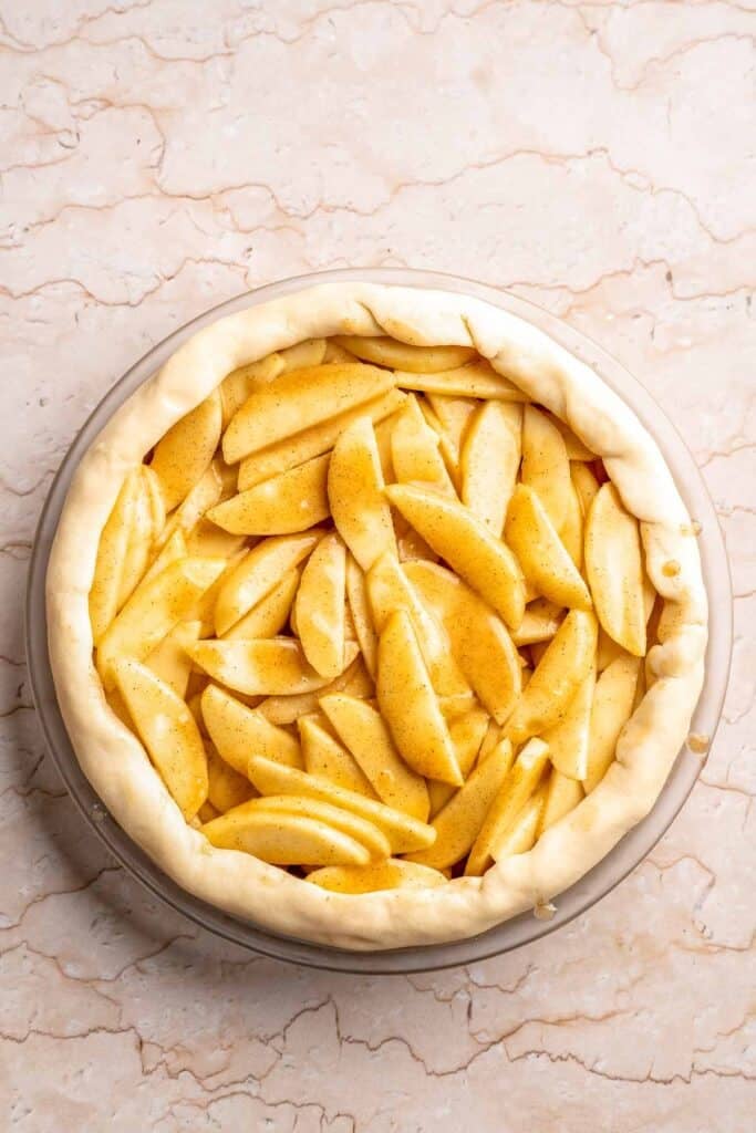 Homemade Caramel Apple Pie is warm, spiced, and gooey. A classic apple pie with caramel sauce baked inside for the ultimate fall dessert. | aheadofthyme.com