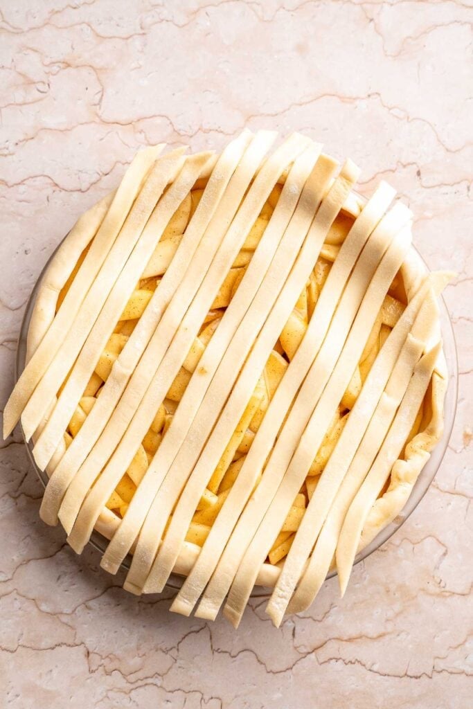 Homemade Caramel Apple Pie is warm, spiced, and gooey. A classic apple pie with caramel sauce baked inside for the ultimate fall dessert. | aheadofthyme.com