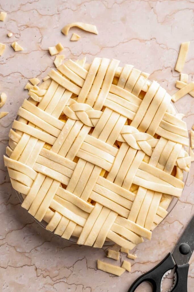 Homemade Caramel Apple Pie is warm, spiced, and gooey. A classic apple pie with caramel sauce baked inside for the ultimate fall dessert. | aheadofthyme.com