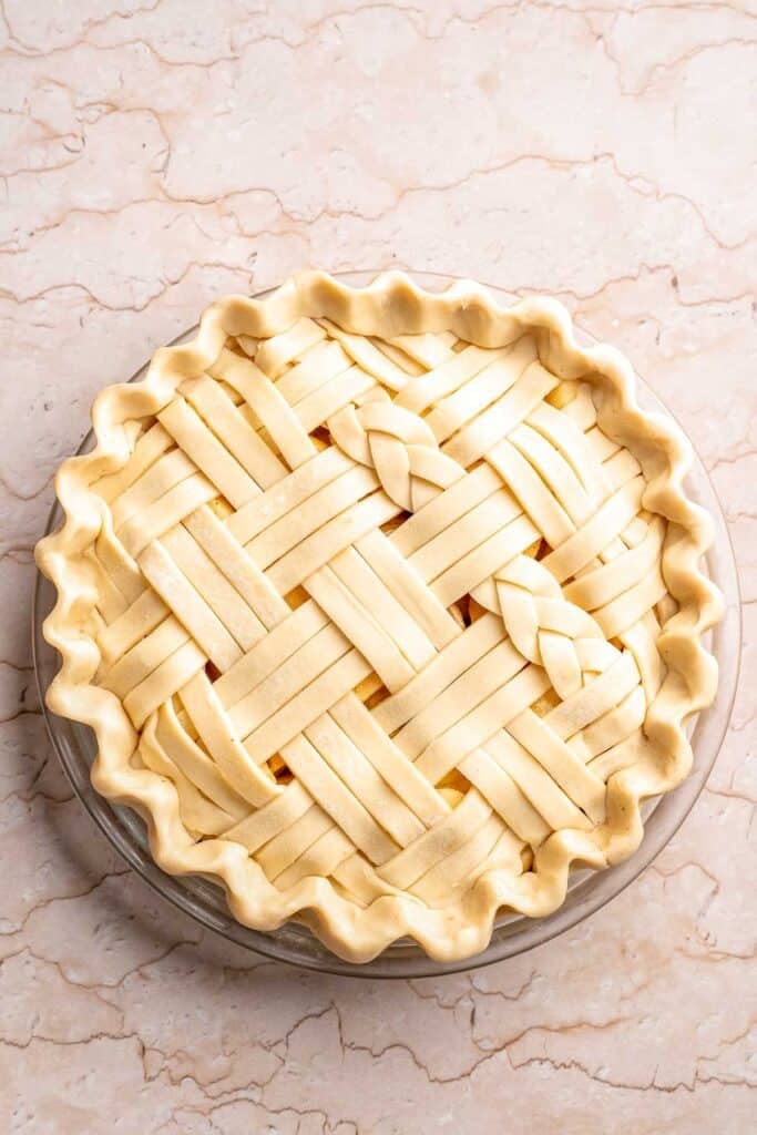 Homemade Caramel Apple Pie is warm, spiced, and gooey. A classic apple pie with caramel sauce baked inside for the ultimate fall dessert. | aheadofthyme.com